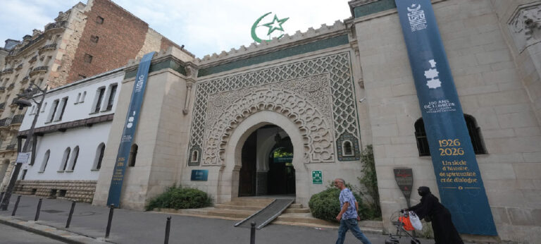 Paris Grand Mosque Anniversary Marks 100 Years The Paris Grand Mosque Anniversary marks a major moment in French history. The famous mosque has now stood for 100 years. It was built to honor Muslim soldiers from French colonies who fought and died during World War I. Today, it remains an important place for prayer, culture, and community in the heart of Paris. People from many backgrounds gathered for the special anniversary event. Some were born in France. Others came from countries such as Algeria, Senegal, and other parts of Africa. Many families have strong historical ties to France through its former colonies. The mosque stands in the busy Latin Quarter. It is known for its beautiful design and peaceful atmosphere. Visitors often admire its large prayer hall, detailed artwork, and tall minaret. The building also includes a tea room and traditional steam baths, making it a popular place for both worshippers and tourists. Even after 100 years, the mosque continues to serve as more than a historic building. It is an active place of worship where thousands of Muslims gather throughout the year. It also welcomes visitors who want to learn about its history and architecture. The mosque was built as a tribute to Muslim soldiers who gave their lives while defending France during World War I. Many of those soldiers came from African territories that were part of the French colonial empire at the time. The project was meant to recognize their courage and sacrifice. Religious leaders said the mosque also represents the values of unity and respect between different faiths. They believe it shows how people from different cultures can share the same national identity while keeping their own traditions. During the anniversary gathering, many worshippers spoke about the importance of peace and mutual understanding. They said the mosque has always been a place where people can meet with respect, regardless of their background. The Paris Grand Mosque Anniversary also comes at a time when discussions about religion and identity remain active in France. Islam is the country's second-largest religion, and France has the biggest Muslim population in Western Europe. Many Muslims say they still face challenges in daily life. Some believe there are misunderstandings about their religion. Others point to discrimination and negative stereotypes that continue to affect Muslim communities. Public debate about immigration and religion has also become more visible as France prepares for its next presidential election. These topics are expected to remain important during the campaign, with different political parties offering their own views on national identity and social policy. Some worshippers also spoke about rules affecting the wearing of Muslim headscarves in certain schools and workplaces. They said people should have the freedom to make personal religious choices while respecting French law. Despite these concerns, the anniversary event focused mainly on hope and unity. Many people said the mosque represents friendship between cultures and encourages peaceful dialogue among different communities. Visitors described the mosque as a welcoming place where everyone can feel at home. For many newcomers arriving in France, it is often one of the first places they visit. Community members said the mosque offers support, guidance, and a sense of belonging. Tourists also continue to visit the landmark throughout the year. Its unique architecture, peaceful gardens, and historic importance make it one of the city's well-known attractions. Many visitors come to admire its beauty while learning more about France's diverse cultural history. As the Paris Grand Mosque Anniversary celebrates a full century, the mosque remains a lasting reminder of shared history, respect, and faith. Built to honor sacrifice during World War I, it continues to bring together people from different cultures and generations. One hundred years after its opening, the Grand Mosque of Paris stands not only as a historic monument but also as a symbol of remembrance, community, and dialogue. Its anniversary highlights both its rich past and its continuing role in modern France.